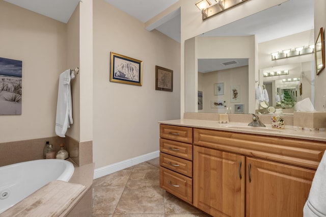 bathroom with tile flooring, vanity, and a tub