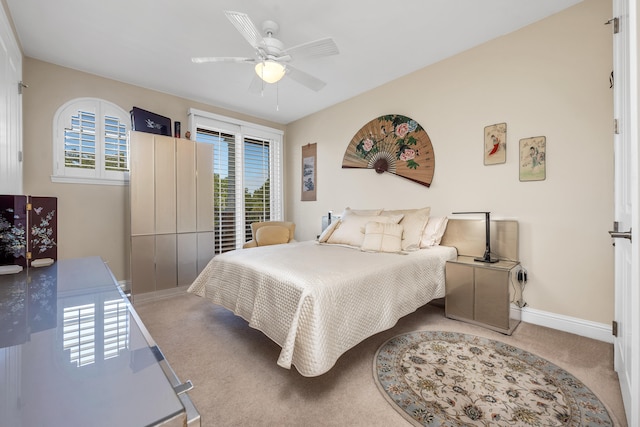 bedroom featuring light carpet and ceiling fan