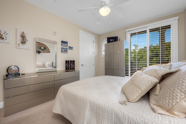 carpeted bedroom featuring ceiling fan