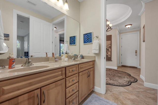 bathroom featuring tile flooring, ornamental molding, large vanity, and double sink