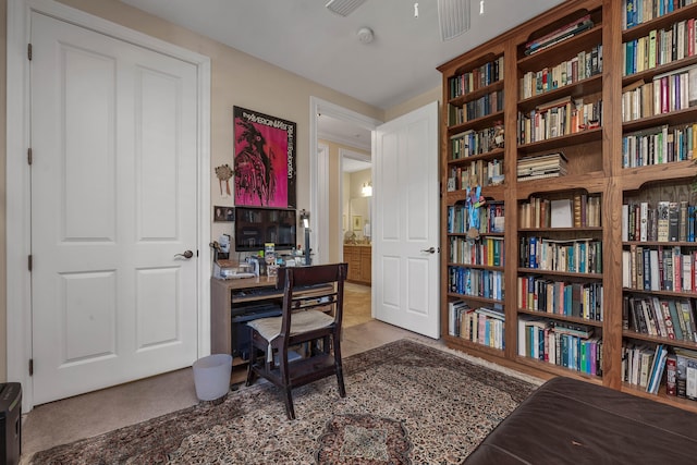 home office with light colored carpet