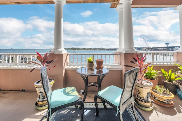 balcony featuring a water view