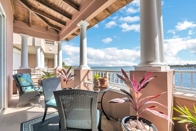 balcony featuring a water view