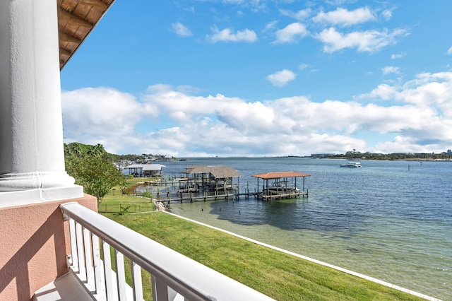 exterior space featuring a dock and a water view