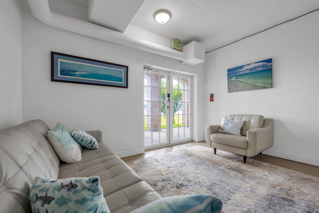 living room with french doors and hardwood / wood-style floors