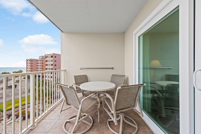 balcony featuring a water view