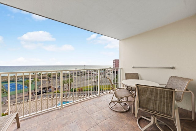 balcony featuring a water view