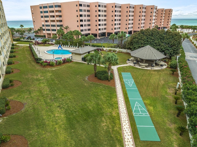 birds eye view of property with a water view