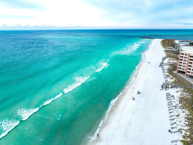 drone / aerial view featuring a view of the beach and a water view