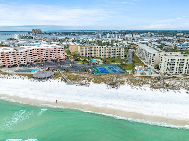 drone / aerial view featuring a view of the beach and a water view