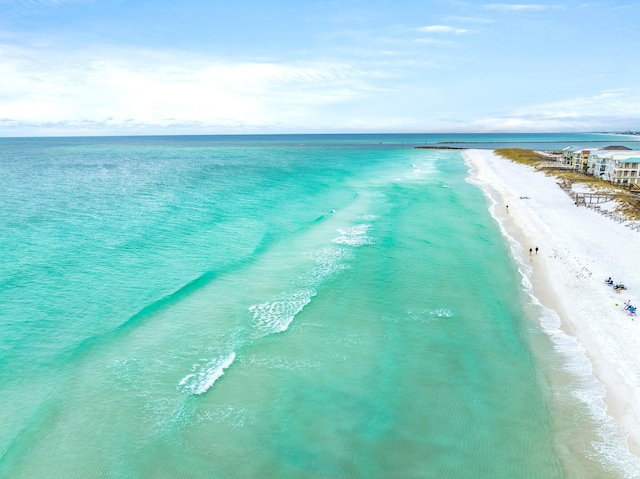 bird's eye view with a water view and a view of the beach