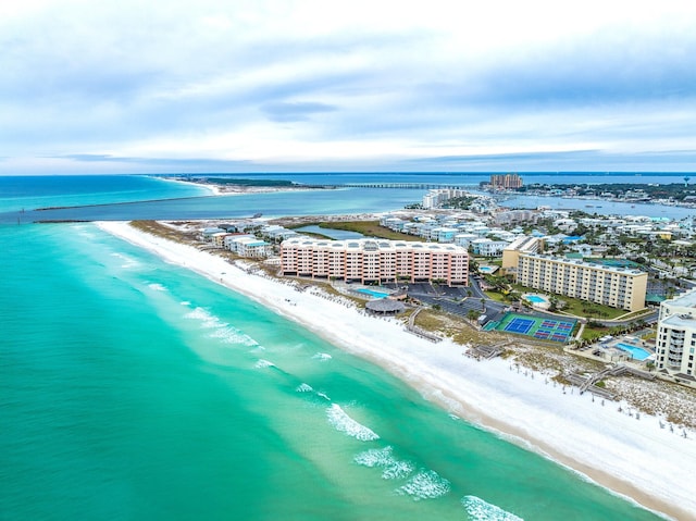 aerial view with a water view and a view of the beach