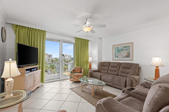 living room featuring light tile patterned floors, a textured ceiling, ceiling fan, and crown molding