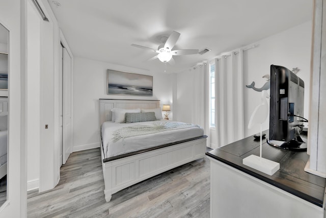 bedroom featuring light hardwood / wood-style flooring and ceiling fan