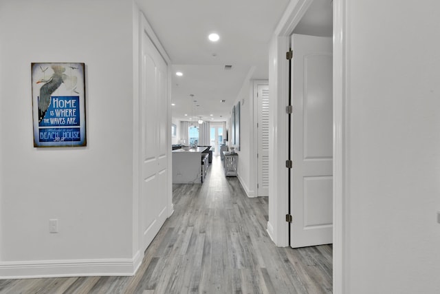 hallway featuring light hardwood / wood-style floors