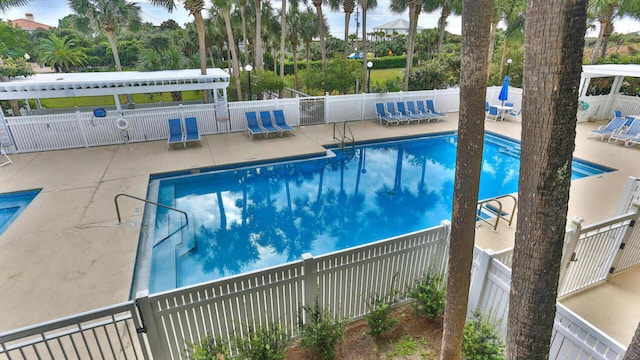 view of swimming pool featuring a patio area