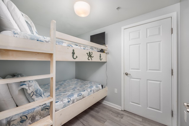 bedroom with hardwood / wood-style flooring