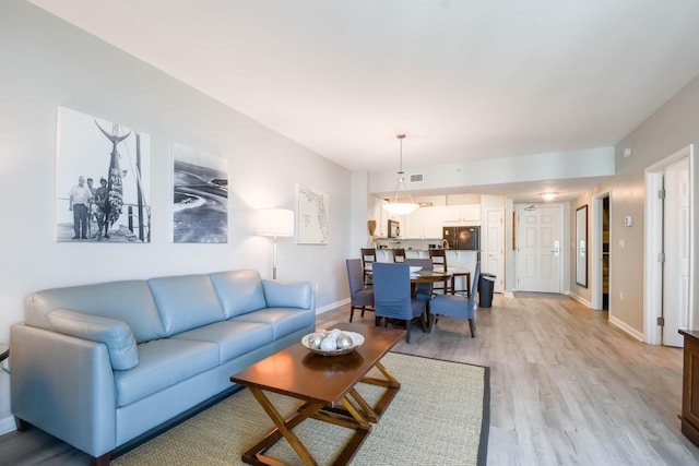 living room with light hardwood / wood-style floors