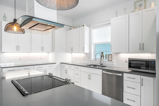 kitchen with white cabinets, sink, backsplash, stainless steel appliances, and premium range hood