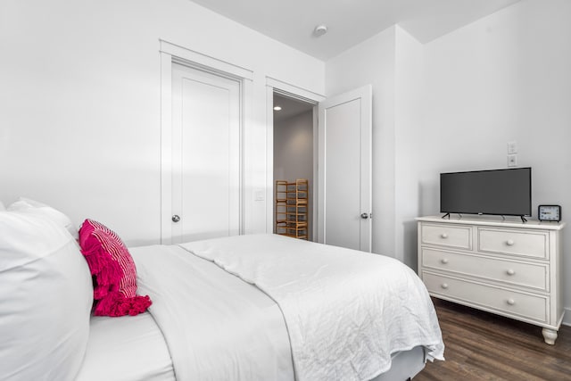 bedroom featuring dark hardwood / wood-style floors