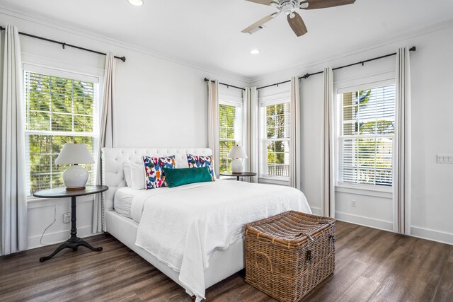 bedroom featuring ceiling fan, dark hardwood / wood-style flooring, and ornamental molding