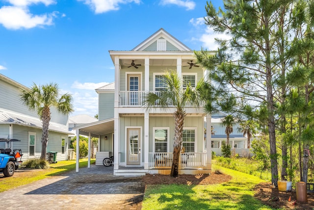 view of front facade with a front lawn, a balcony, covered porch, and ceiling fan