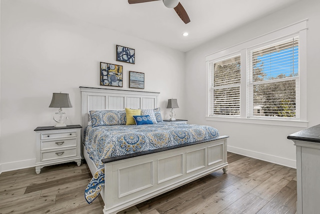 bedroom featuring dark hardwood / wood-style flooring and ceiling fan