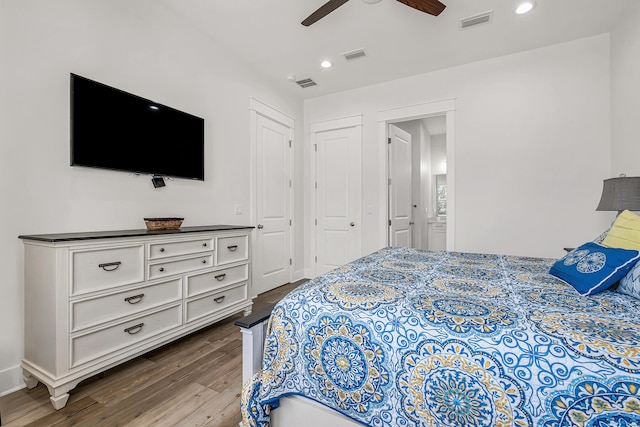 bedroom with ceiling fan and dark wood-type flooring