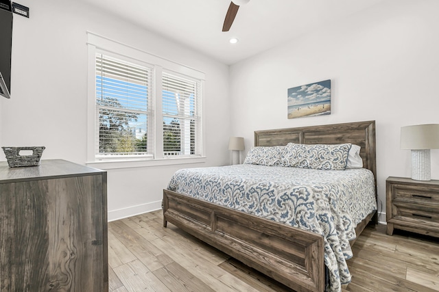 bedroom featuring light hardwood / wood-style flooring and ceiling fan