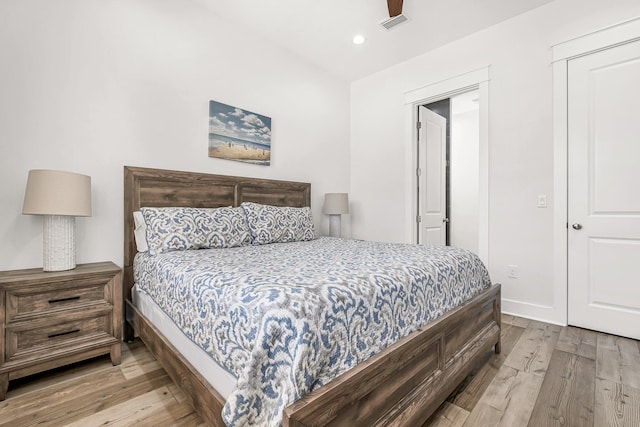 bedroom featuring light hardwood / wood-style flooring and ceiling fan