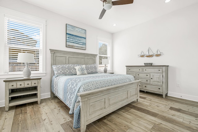 bedroom featuring light hardwood / wood-style floors and ceiling fan