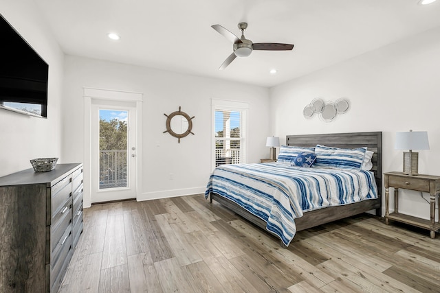 bedroom with light hardwood / wood-style flooring, ceiling fan, access to exterior, and multiple windows