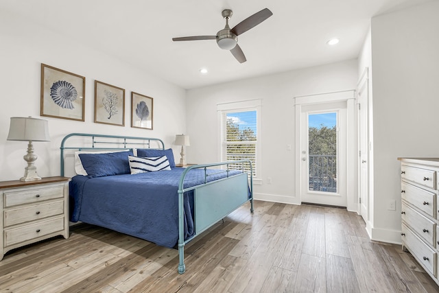 bedroom featuring access to outside, light hardwood / wood-style floors, and ceiling fan