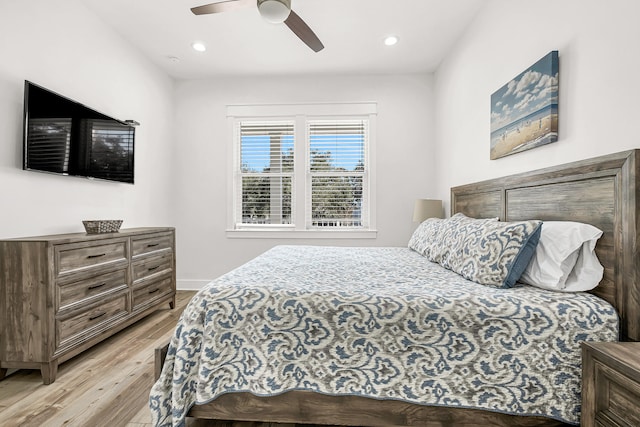 bedroom featuring ceiling fan and light hardwood / wood-style flooring