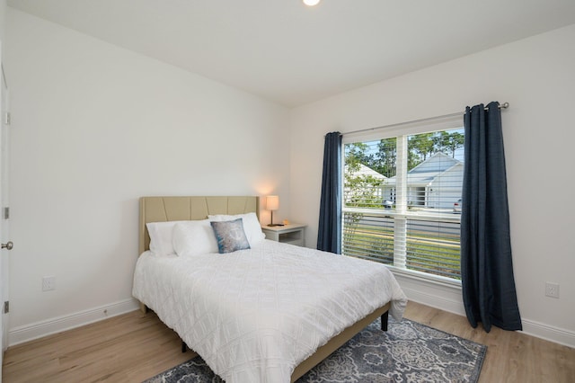 bedroom with light hardwood / wood-style flooring