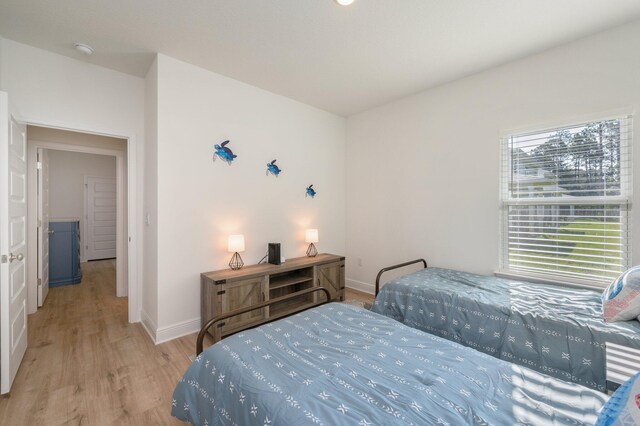 bedroom with light wood-type flooring