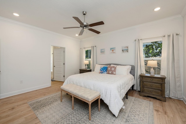 bedroom with ceiling fan, crown molding, and light wood-type flooring