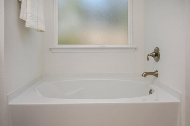 bathroom with a tub