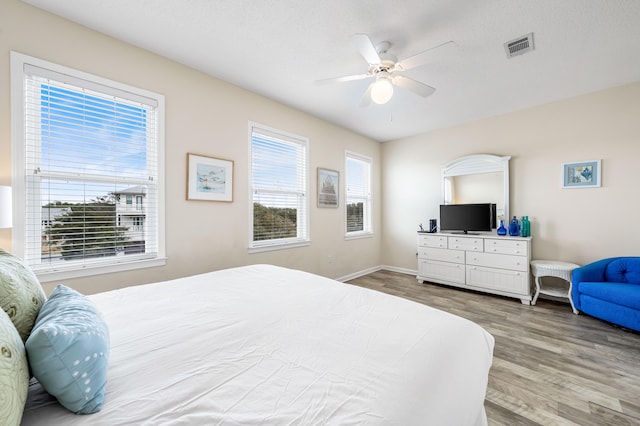 bedroom featuring hardwood / wood-style flooring and ceiling fan