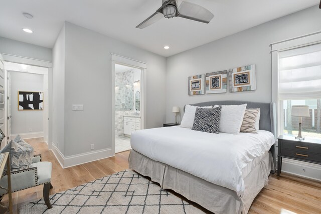 bedroom with ceiling fan, light hardwood / wood-style floors, and connected bathroom