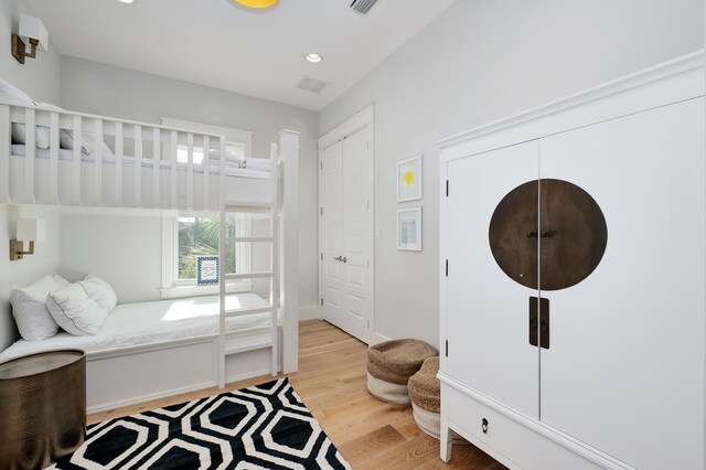 bedroom with light hardwood / wood-style floors