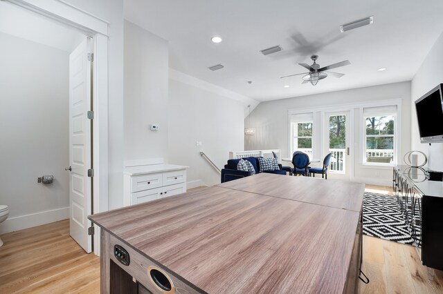 interior space with light hardwood / wood-style flooring and ceiling fan