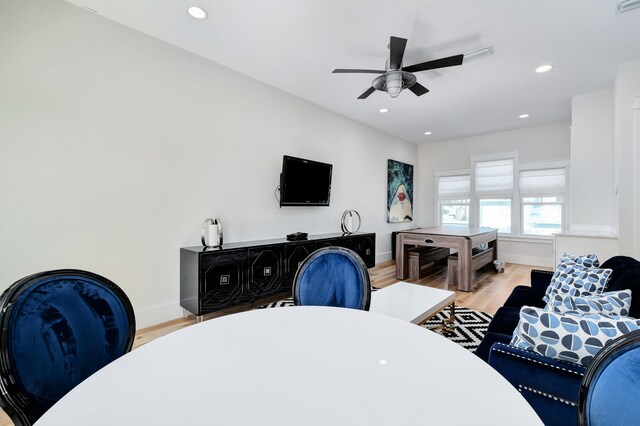 living room featuring ceiling fan and light wood-type flooring