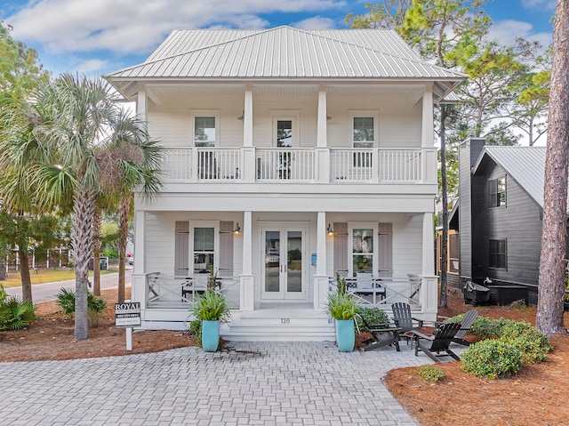 view of front facade featuring a balcony and covered porch