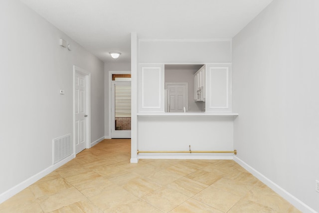 empty room featuring light tile floors