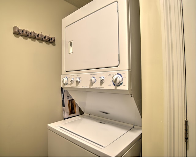 laundry room featuring stacked washer and dryer