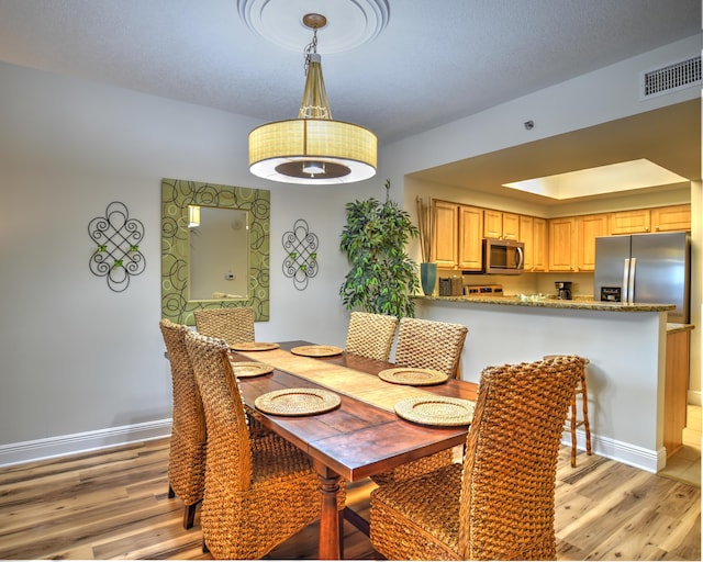 dining area featuring light hardwood / wood-style flooring