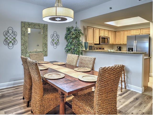 dining area featuring light hardwood / wood-style floors