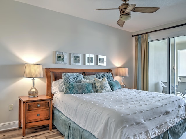 bedroom with light hardwood / wood-style floors and ceiling fan