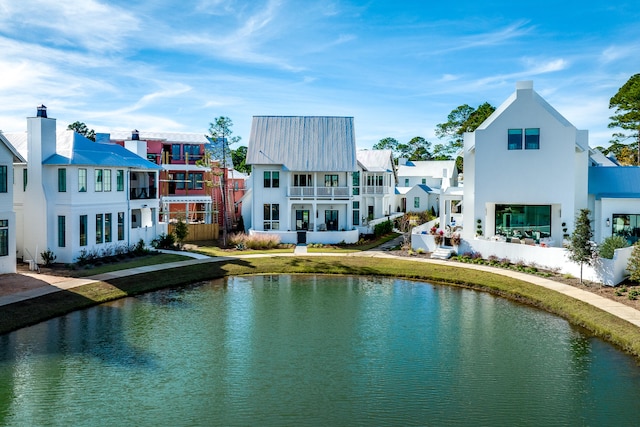 exterior space with a water view and a yard